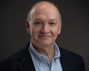 Professional headshot of Chuck Zollinger.
